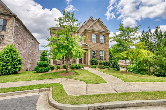4895 Sterling Close, Buford, GA 30518 - view of front of property featuring a front yard and brick siding