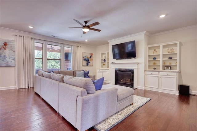 4895 Sterling Close, Buford, GA 30518 - living area with a ceiling fan, ornamental molding, dark wood-style floors, a premium fireplace, and recessed lighting