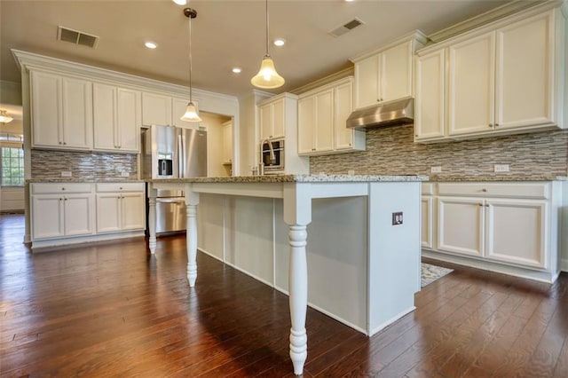 4895 Sterling Close, Buford, GA 30518 - kitchen featuring under cabinet range hood, stainless steel fridge with ice dispenser, dark wood-type flooring, backsplash, and recessed lighting