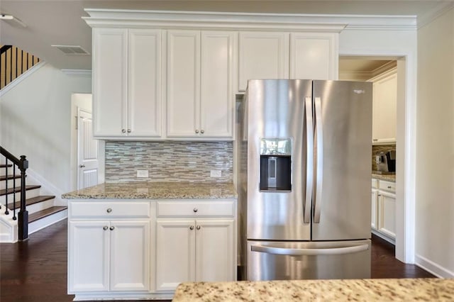 4895 Sterling Close, Buford, GA 30518 - kitchen featuring stainless steel refrigerator with ice dispenser, crown molding, dark wood finished floors, tasteful backsplash, and white cabinetry