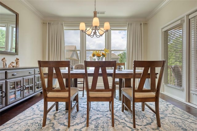 4895 Sterling Close, Buford, GA 30518 - dining space featuring a chandelier, ornamental molding, healthy amount of natural light, and wood finished floors