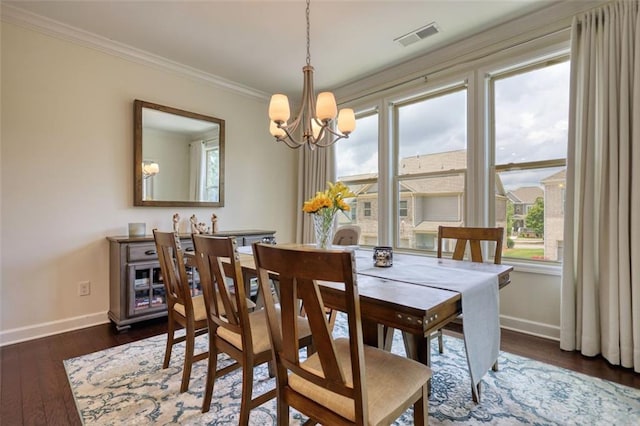4895 Sterling Close, Buford, GA 30518 - dining area with a chandelier, plenty of natural light, crown molding, and dark wood-type flooring