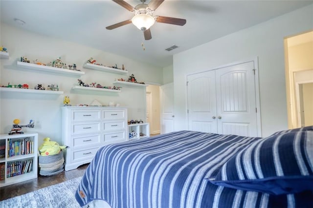 4895 Sterling Close, Buford, GA 30518 - bedroom with a closet, a ceiling fan, and dark wood-style flooring