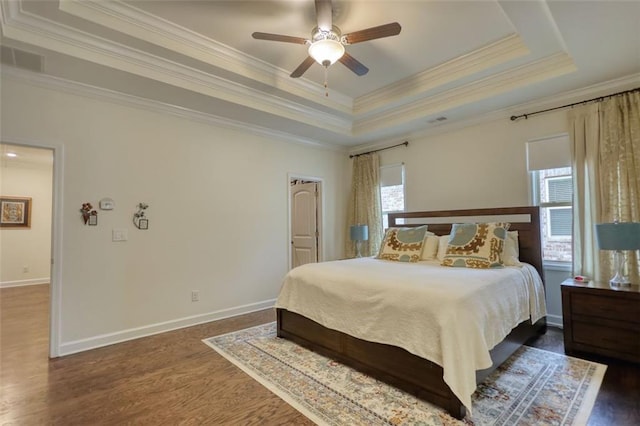 4895 Sterling Close, Buford, GA 30518 - bedroom featuring ornamental molding, dark wood-type flooring, a raised ceiling, and ceiling fan