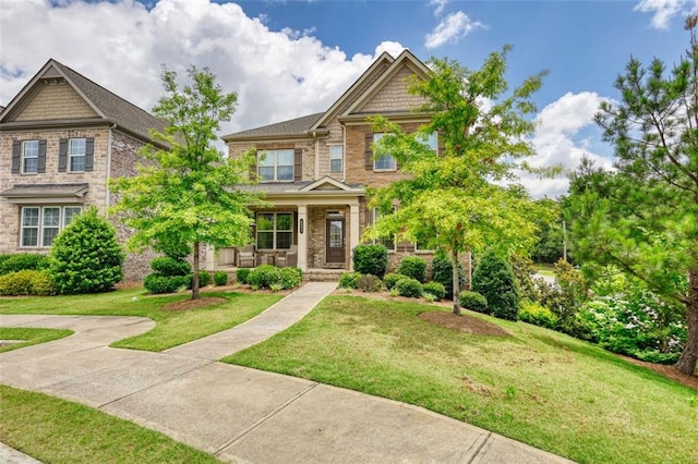 4895 Sterling Close, Buford, GA 30518 - craftsman inspired home featuring a porch and a front lawn