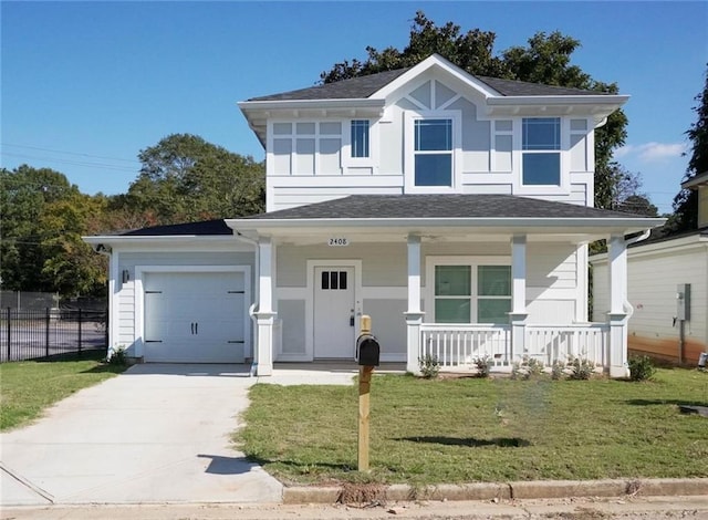 view of front of property with a garage, a front yard, and covered porch