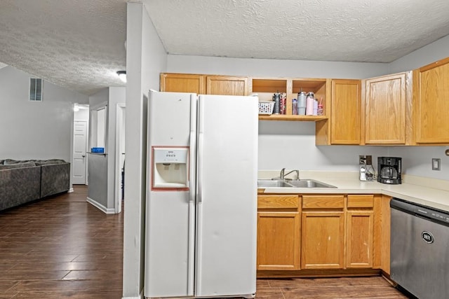 kitchen with white fridge with ice dispenser, dark wood finished floors, a sink, and stainless steel dishwasher