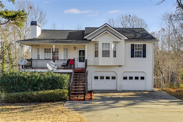 674 Fairview Dr, Dallas, GA 30157 - view of front facade featuring an attached garage, a porch, driveway, a chimney, and stairway