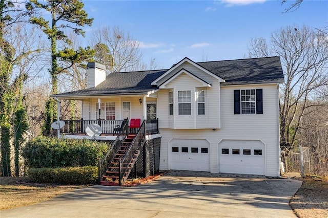 674 Fairview Dr, Dallas, GA 30157 - view of front of home with driveway, a porch, a garage, stairs, and a chimney