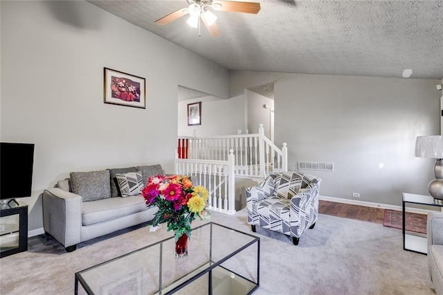 674 Fairview Dr, Dallas, GA 30157 - living room with ceiling fan, carpet, lofted ceiling, a textured ceiling, and baseboards