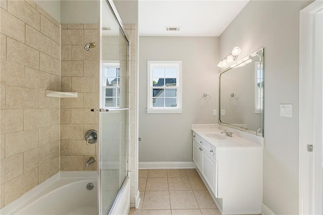 bathroom featuring enclosed tub / shower combo, tile floors, and vanity