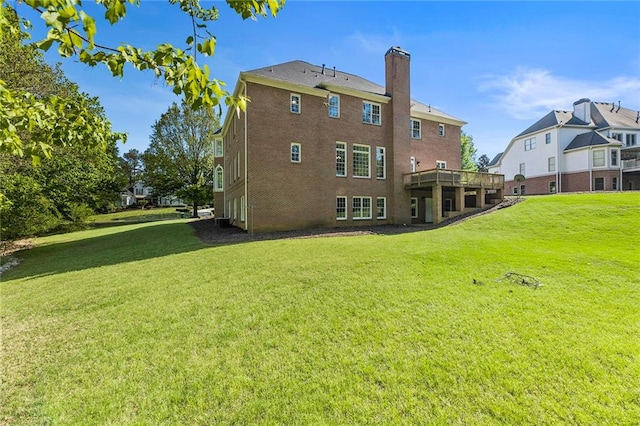 back of house featuring a lawn