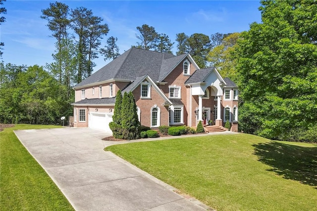 view of front of house with a front lawn and a garage