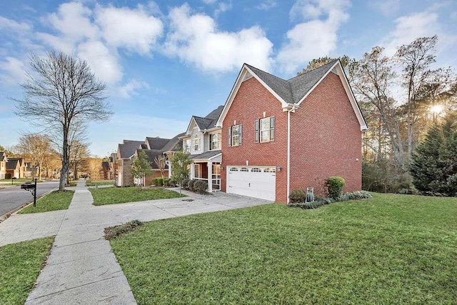 view of side of property with a lawn and a garage