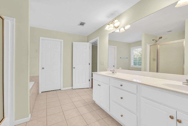 bathroom with plus walk in shower, vanity, and tile patterned floors