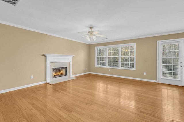 unfurnished living room featuring ceiling fan, light hardwood / wood-style floors, and ornamental molding