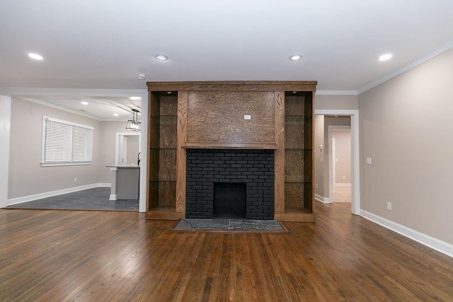 unfurnished living room with dark hardwood / wood-style floors, crown molding, and a tile fireplace