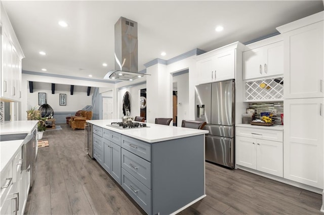 kitchen featuring island exhaust hood, gray cabinetry, appliances with stainless steel finishes, white cabinets, and a kitchen island