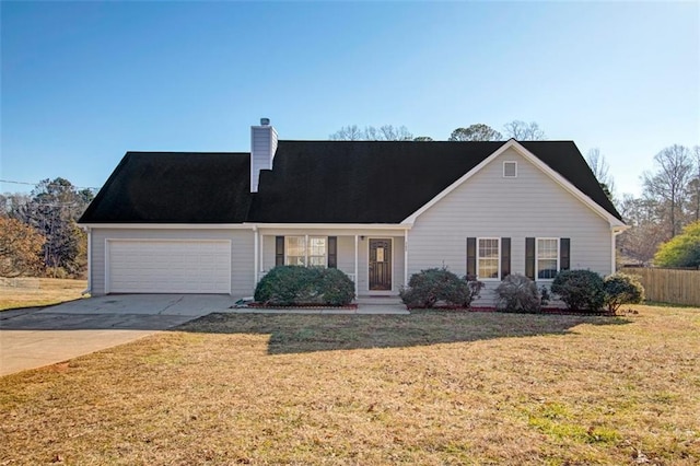 view of front of house with a front lawn and a garage