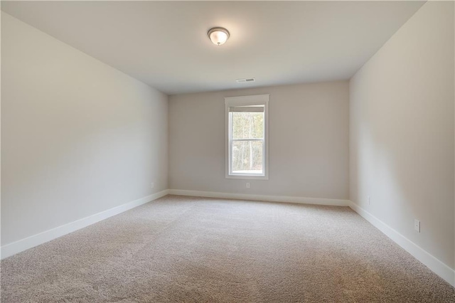 spare room featuring carpet flooring