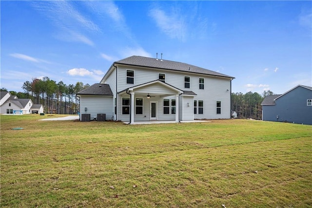 back of house featuring a lawn, central AC, ceiling fan, and a patio