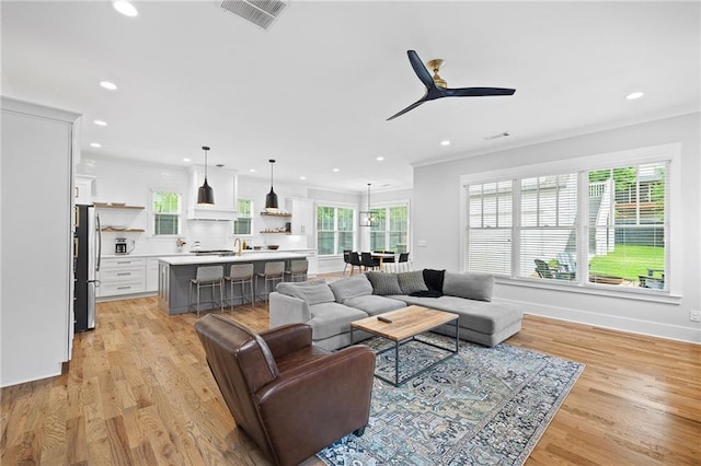 313 Sisson Ave NE, Atlanta, GA 30317 - living room featuring recessed lighting, healthy amount of natural light, light wood-style floors, and ceiling fan