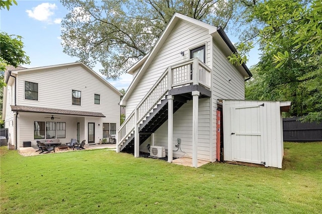 313 Sisson Ave NE, Atlanta, GA 30317 - back of property featuring stairway, ceiling fan, a cooling unit, a patio, and an outdoor living space with a fire pit