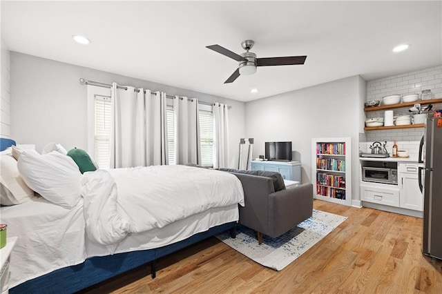 313 Sisson Ave NE, Atlanta, GA 30317 - bedroom featuring freestanding refrigerator, light wood-style floors, recessed lighting, and a ceiling fan