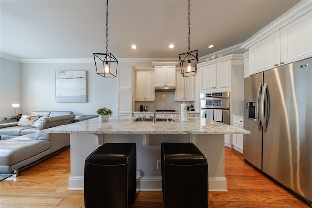 359 Alderwood Ln, Atlanta, GA 30328 - kitchen featuring stainless steel appliances, a sink, white cabinetry, open floor plan, and ornamental molding