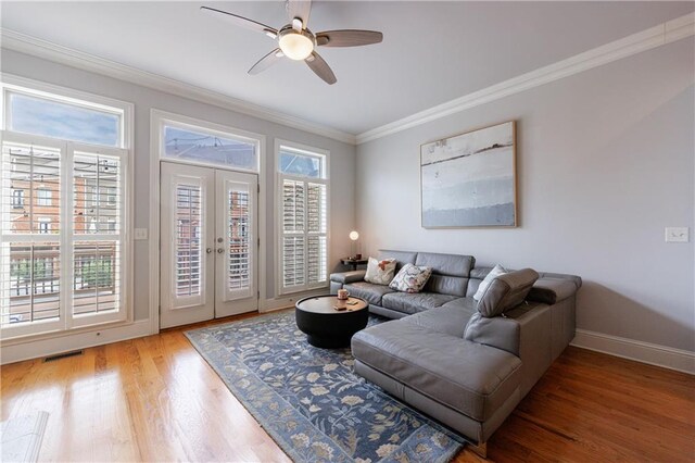 359 Alderwood Ln, Atlanta, GA 30328 - living area featuring crown molding, a ceiling fan, wood finished floors, baseboards, and french doors