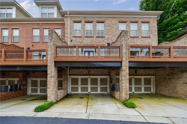 359 Alderwood Ln, Atlanta, GA 30328 - back of property featuring brick siding, cooling unit, and a wooden deck