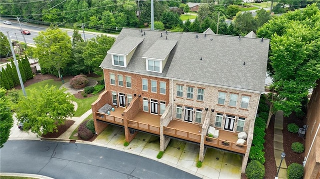359 Alderwood Ln, Atlanta, GA 30328 - back of property featuring a deck, brick siding, roof with shingles, and fence
