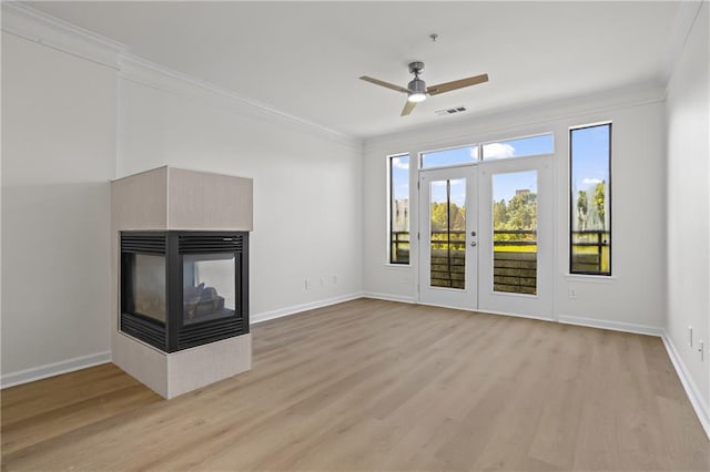 401 16th St NW Unit 1357, Atlanta, GA 30363 - unfurnished living room featuring ornamental molding, ceiling fan, light wood finished floors, and a multi sided fireplace