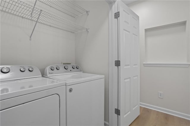 401 16th St NW Unit 1357, Atlanta, GA 30363 - washroom featuring separate washer and dryer and light wood-style floors