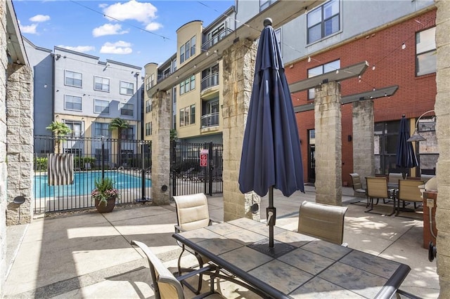 401 16th St NW Unit 1357, Atlanta, GA 30363 - view of patio / terrace featuring outdoor dining area and a community pool