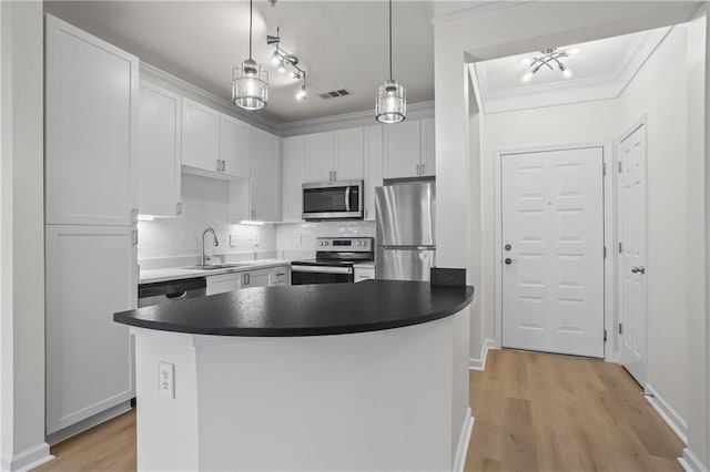 401 16th St NW Unit 1357, Atlanta, GA 30363 - kitchen featuring appliances with stainless steel finishes, light wood-type flooring, tasteful backsplash, crown molding, and white cabinets