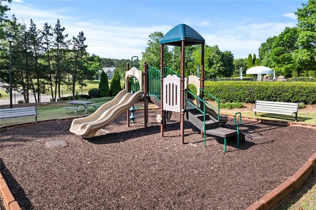 communal playground featuring fence