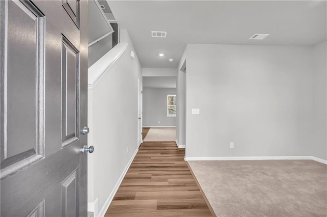 hallway with wood-type flooring