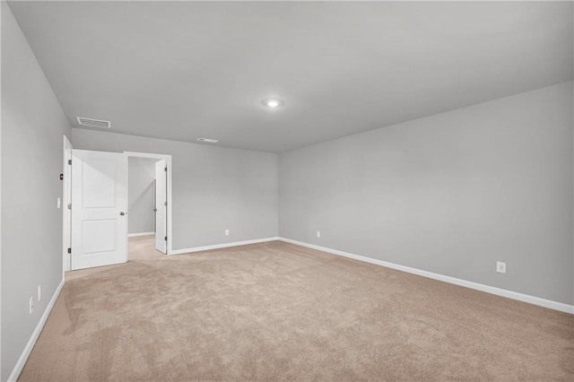 spare room with light colored carpet