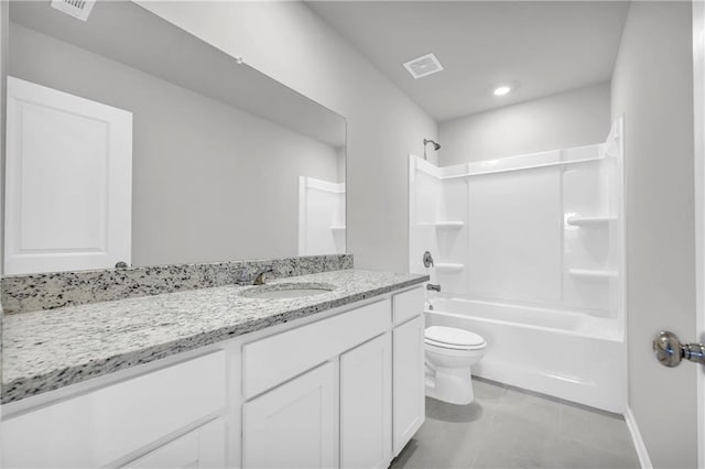 full bathroom featuring vanity, washtub / shower combination, tile patterned floors, and toilet