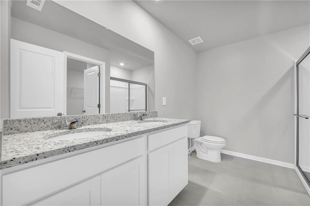 bathroom featuring toilet, an enclosed shower, and vanity