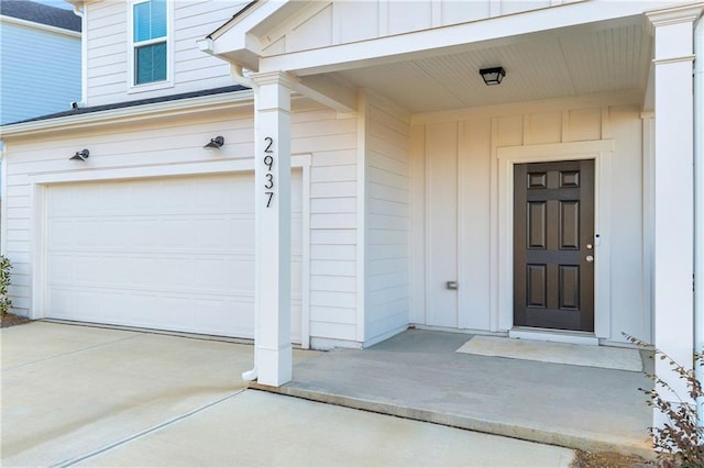 doorway to property with a garage