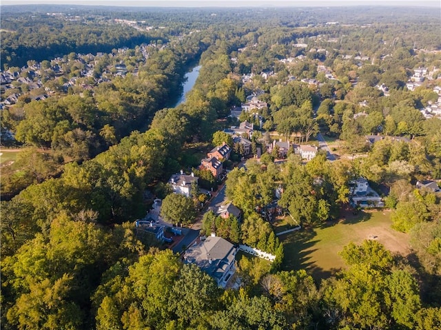 birds eye view of property with a wooded view