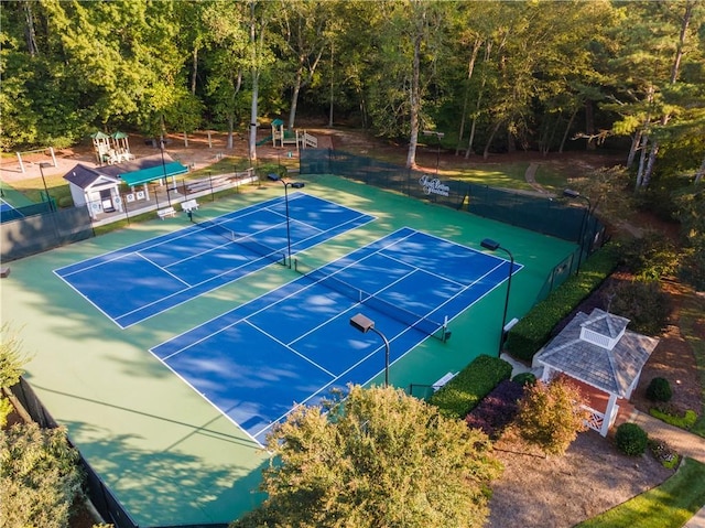 view of tennis court with fence