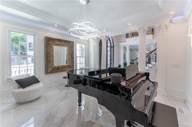 sitting room featuring a wealth of natural light, marble finish floor, a raised ceiling, and ornate columns