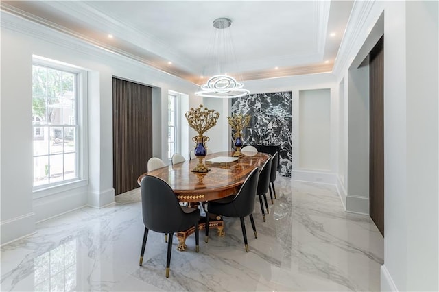 dining area with marble finish floor, ornamental molding, a tray ceiling, recessed lighting, and baseboards