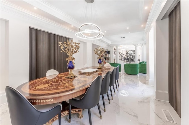 dining area with ornamental molding, recessed lighting, an inviting chandelier, marble finish floor, and ornate columns