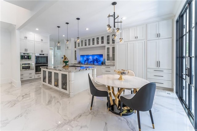 dining room featuring marble finish floor, recessed lighting, an inviting chandelier, crown molding, and baseboards