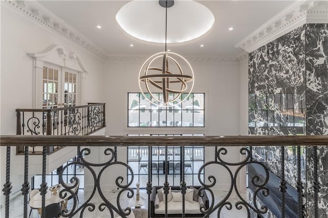 interior space featuring a chandelier, recessed lighting, and ornamental molding