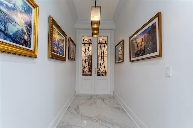 hallway featuring baseboards, marble finish floor, french doors, and ornamental molding